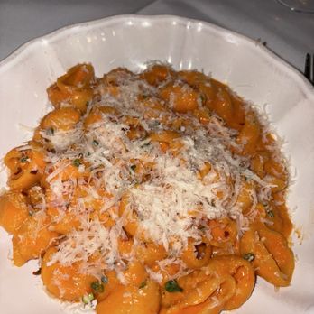 Anjelica’s Restaurant signature dishes Vodka Orecchiette, Double Cut Pork Chop, Scallops.